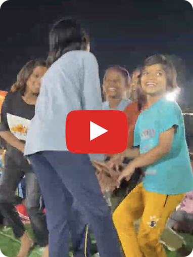 AIM for Seva Inder & Prabha Sharma Girls School students treating Maitreyi to an impromptu song and dance performance