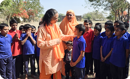 Raja sharing advice and encouragement with a boy from the AIM for Seva school in Indore